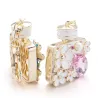 Frasco de perfume com cristais e flores - chaveiro