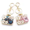 Perfume bottle with crystals and flowers - keychain