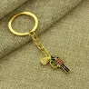 llaverollavero de pistola de oro
