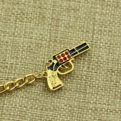 llaverollavero de pistola de oro