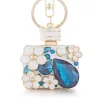 Perfume bottle with crystals and flowers - keychain