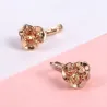 Örhängen med blomma och gul kristall - rosa guld