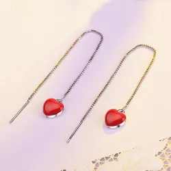 Long earrings with red heart