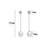 Långa örhängen med kristall och vit pärla