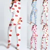 Sovedragt med knapper - pyjamas i ét stykke med funktionel klap bagpå