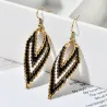 AretesBohemian style - V-shaped - drop earrings - with bead decoration