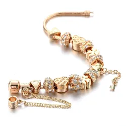 PulseraPulsera de oro de moda con dijes - corazones - abalorios - trébol - llave
