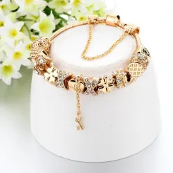PulseraPulsera de oro de moda con dijes - corazones - abalorios - trébol - llave