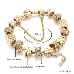 Bracciale in oro alla moda con ciondoli - cuori - perline - trifoglio - chiave
