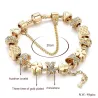 Bracciale in oro alla moda con ciondoli - cuori - perline - trifoglio - chiave
