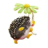 Hedgehog holding flower - crystal brooch