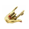 Hand with "Love" gesture - red nails - punk brooch