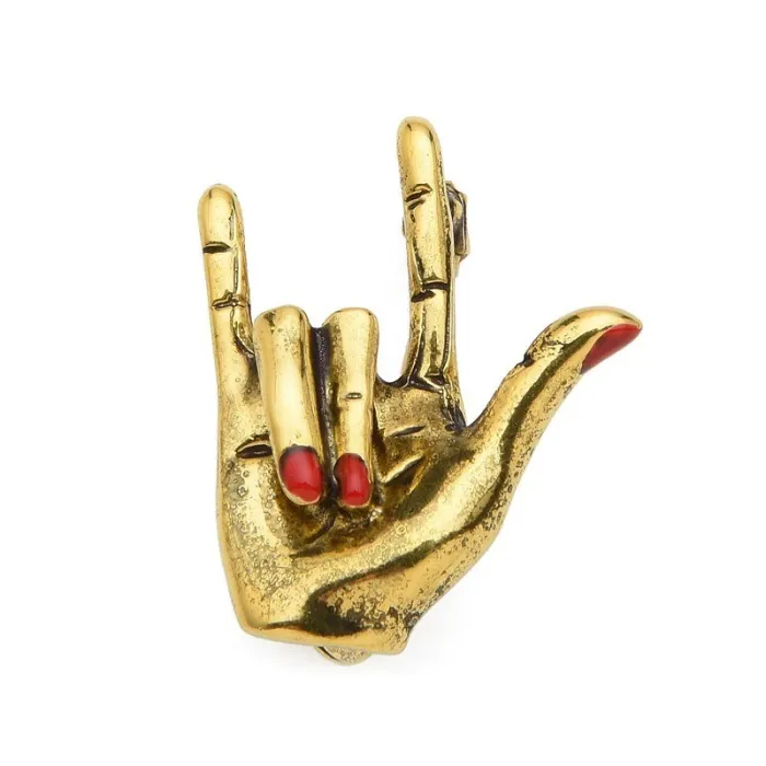 Hand with "Love" gesture - red nails - punk brooch