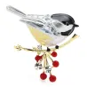 A bird sitting on a branch - crystal brooch