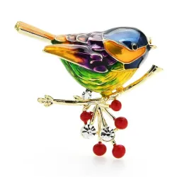 A bird sitting on a branch - crystal brooch