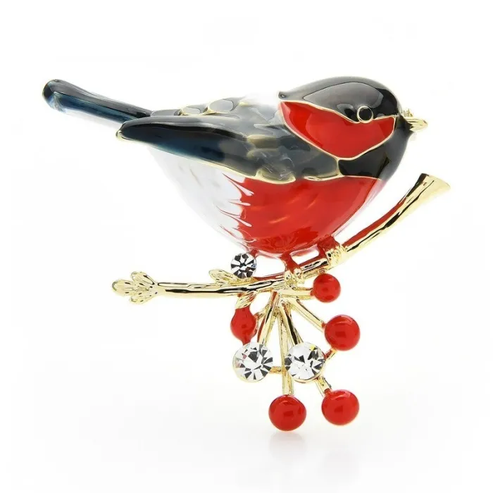 A bird sitting on a branch - crystal brooch
