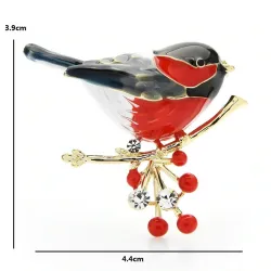 A bird sitting on a branch - crystal brooch