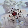 Stylish flower brooch - with glass crystals