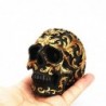 Black skull head - with golden carvings - resin statue