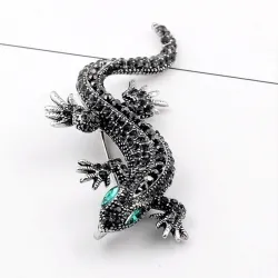 Vintage brooch with crystal lizard