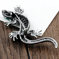 Vintage brooch with crystal lizard