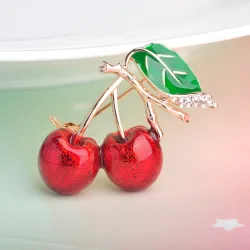 BrochesElegant brooch with red crystal cherry