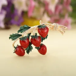 Elegant brooch with a sprig of strawberries