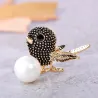 Vintage vogel broche met parelBroches