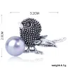 Vintage bird-shaped brooch with pearl
