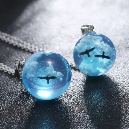 Necklace with transparent resin ball - luminous - blue sky / clouds / birds