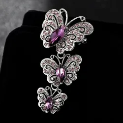 Vintage broche met driedubbele kristallen vlindersBroches