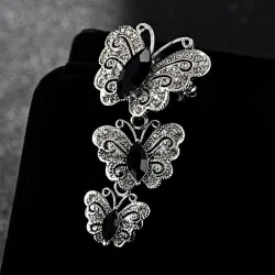 Vintage broche met driedubbele kristallen vlindersBroches