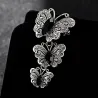 Vintage broche met driedubbele kristallen vlindersBroches