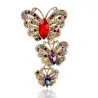 Vintage broche met driedubbele kristallen vlindersBroches
