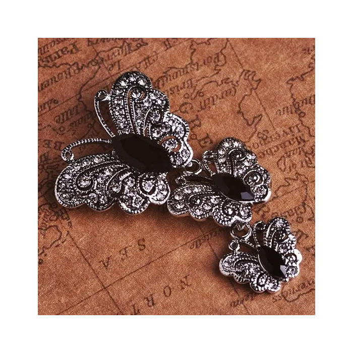 Vintage broche met driedubbele kristallen vlindersBroches