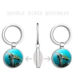 Blaues Meeresleben - runder doppelseitiger Glasschlüsselanhänger - Schildkröte / Delfin / Muscheln