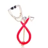 Stethoscope shaped brooch with crystal