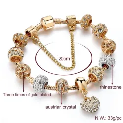 Luxe gouden armband - met kristal kralen / hartArmbanden