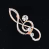 Luxurious gold brooch - with crystal music note