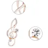 Luxurious gold brooch - with crystal music note