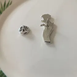 Silver brooch with a hand holding rose - pin