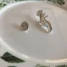Silver brooch with a hand holding rose - pin