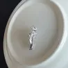 Silver brooch with a hand holding rose - pin