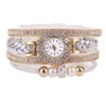 Mehrschichtiges Armband mit runder Uhr - Kristalle / Perlen
