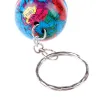 llaveroTrendy keychain with world map globe