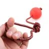 Rubber training ball for dogs - teeth cleaning - with a rope
