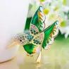 Elegant brooch - with green crystal bird