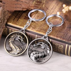 Round metal keychain with dragon