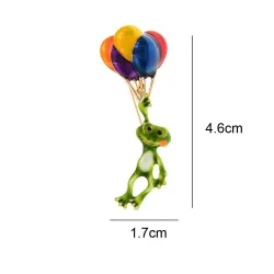 Moderiktig brosch med grön groda / färgglada ballonger
