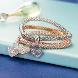 Elegante bracciale in tre pezzi - con cuori di cristallo - argento - oro - oro rosa